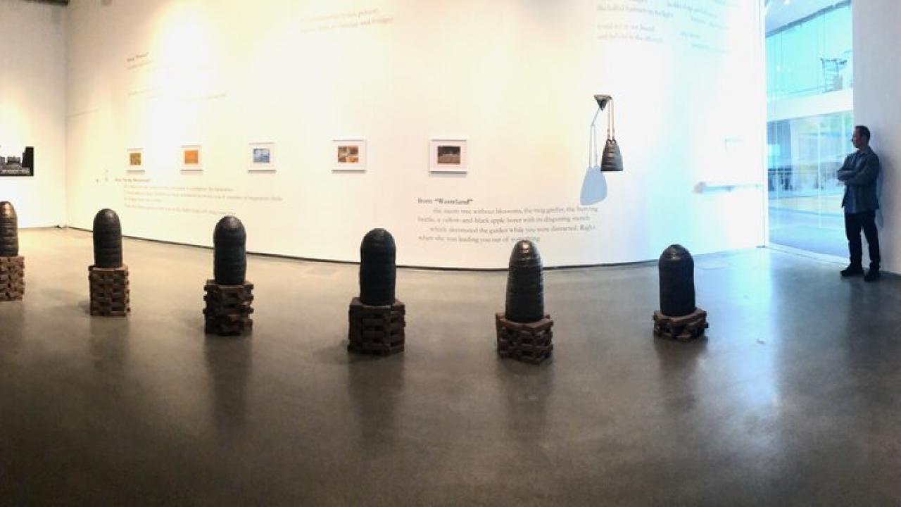 The sculptures of Ashwini Bhat and poetry of Forrest Gander are displayed in a art gallery space.